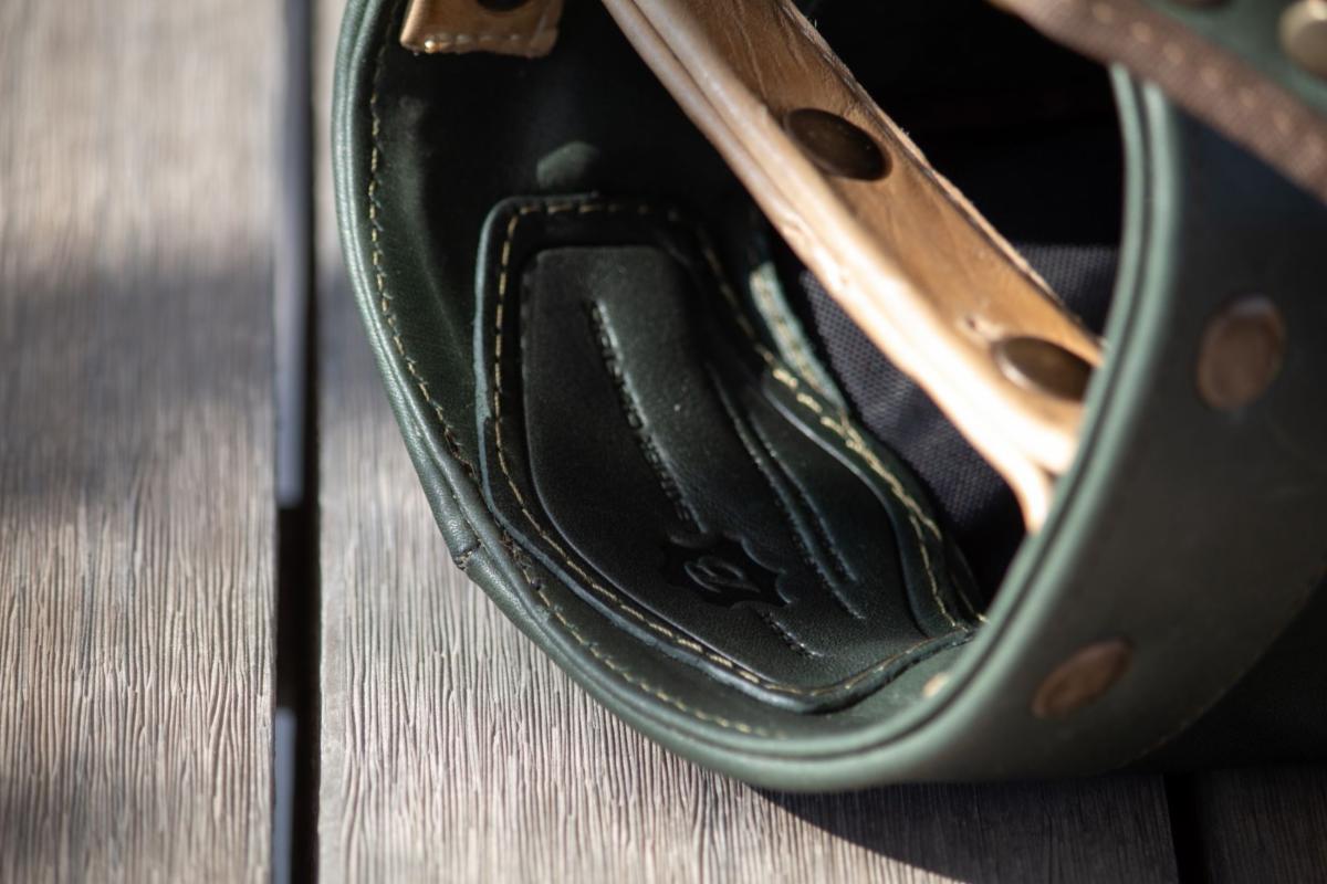 Interior leather detail of the Pizá Golf x Bobby Golf Heart and Soul pencil bag in Pine Green